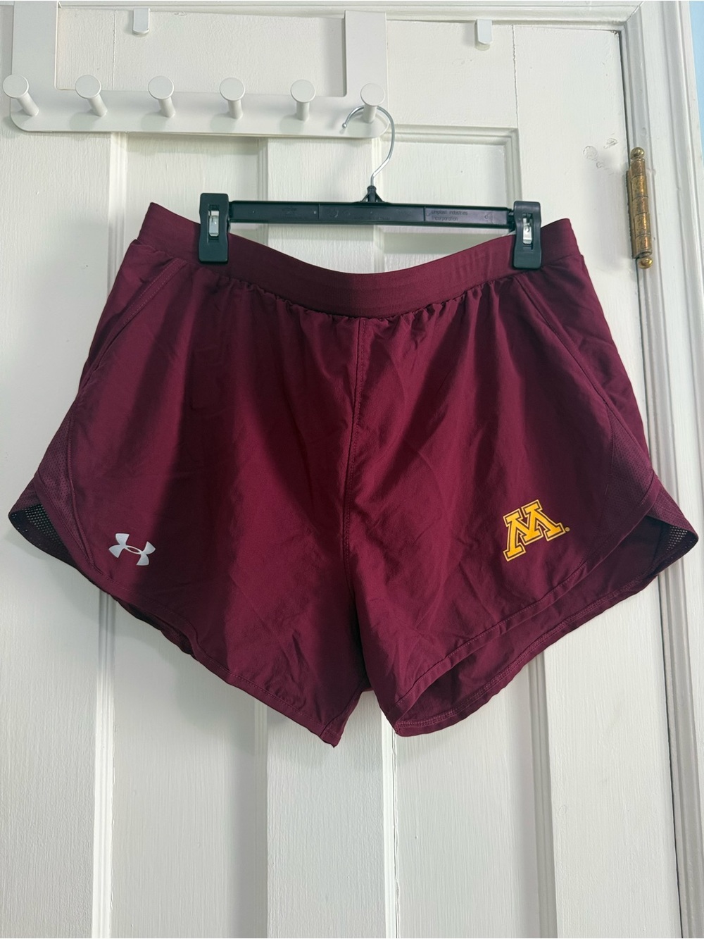 Under Armour Women's Maroon Athletic Shorts with Gold Logo